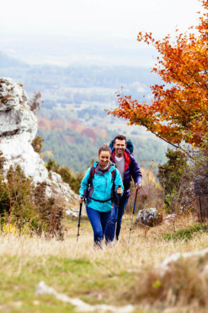 Happy couple hiking during autumn