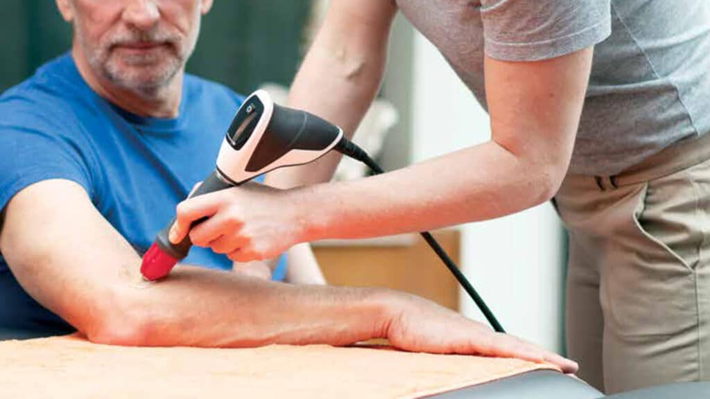 Man receiving shockwaver therapy in Englewood, CO, Denver
